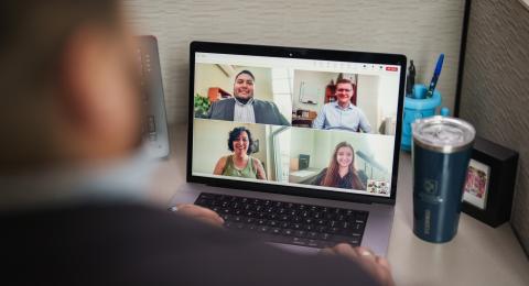 iamge of a computer with a zoom call on 