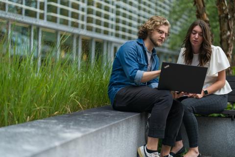 Graduate students studying outside